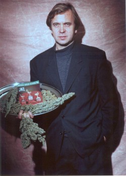 A youthful Ben Dronkers proudly displays an early Sensi Seed Bank catalogue, and a selection of huge mouth-watering cannabis buds