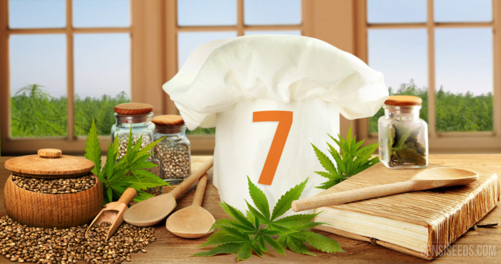 A chef cap with number 7, cook book, wooden spoon, cannabis seeds and leaves