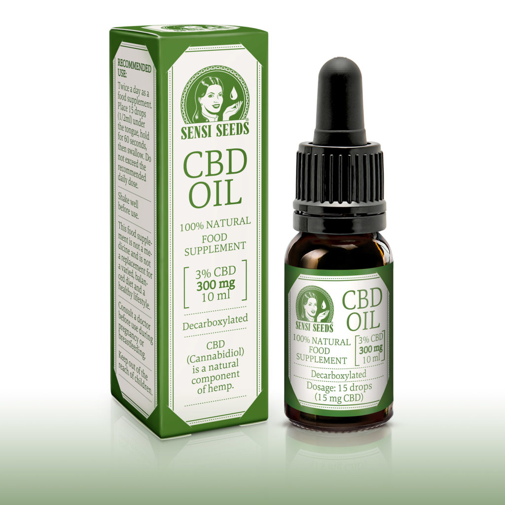 A CBD oil bottle next to its rectangular green and white packaging 