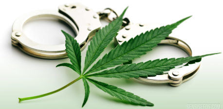 A cannabis leaf and a pair of handcuffs