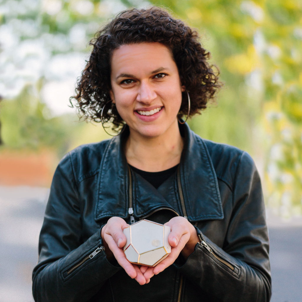 Ariel Zimman with a large gold and white GeoPipe