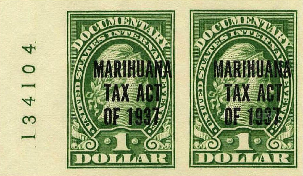 Two green one dollar bills with the text "Marihuana Tax Act of 1937"