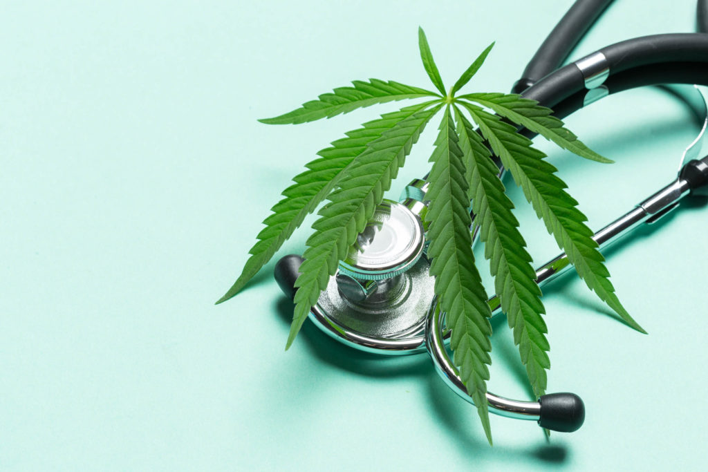 A stethoscope and a cannabis leaf