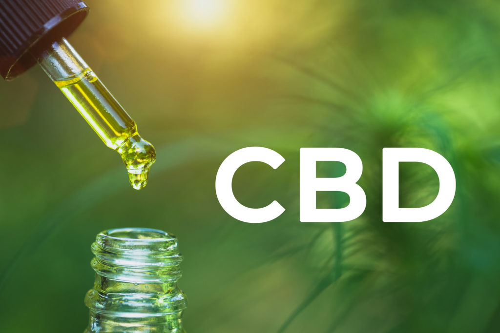 Huile de CBD dégoulinant d'une pipette