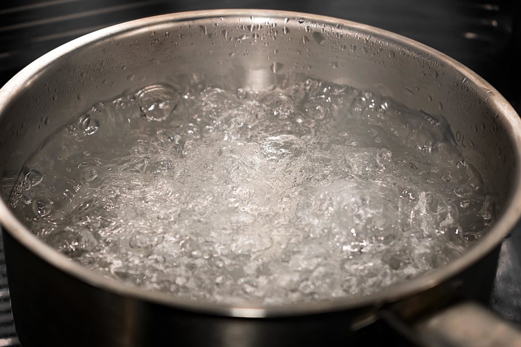 Boiling water in a saucepan