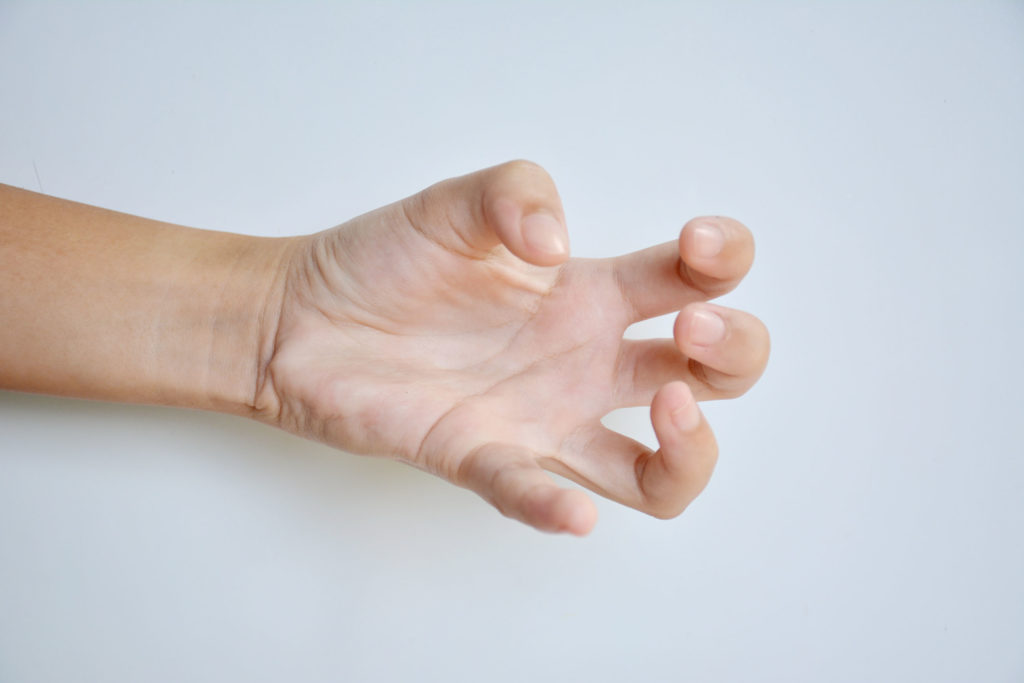 A clenched hand against the white background