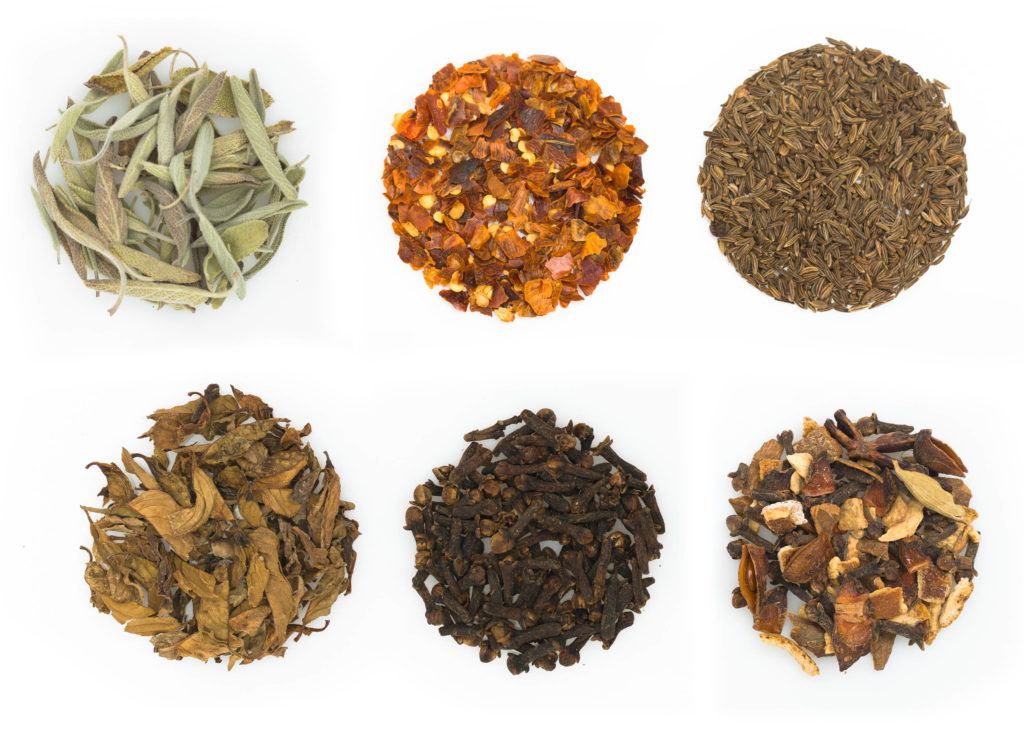 Various herbs against the white background