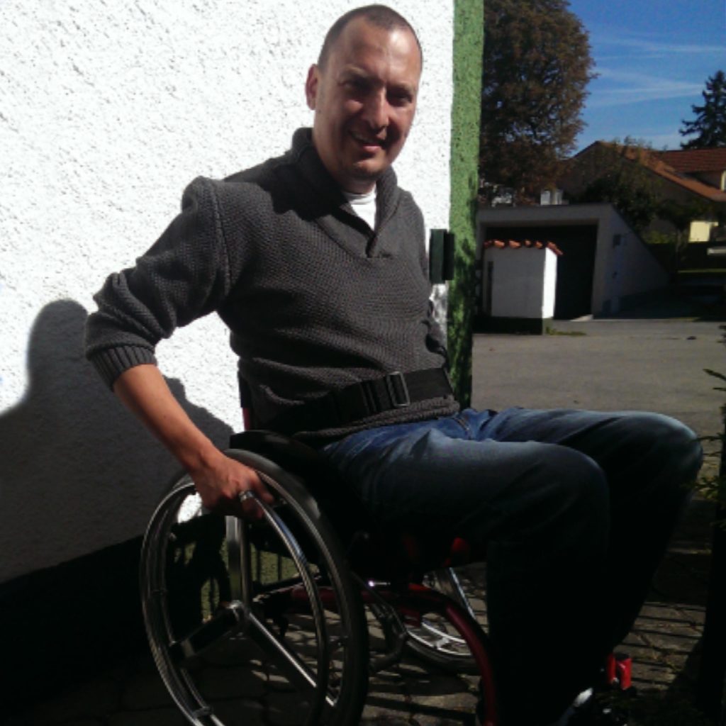 Michael Autrum in a wheelchair outdoors