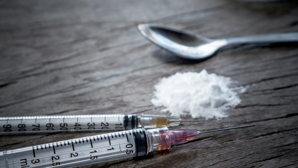 Opiates with syringe, needles and spoon