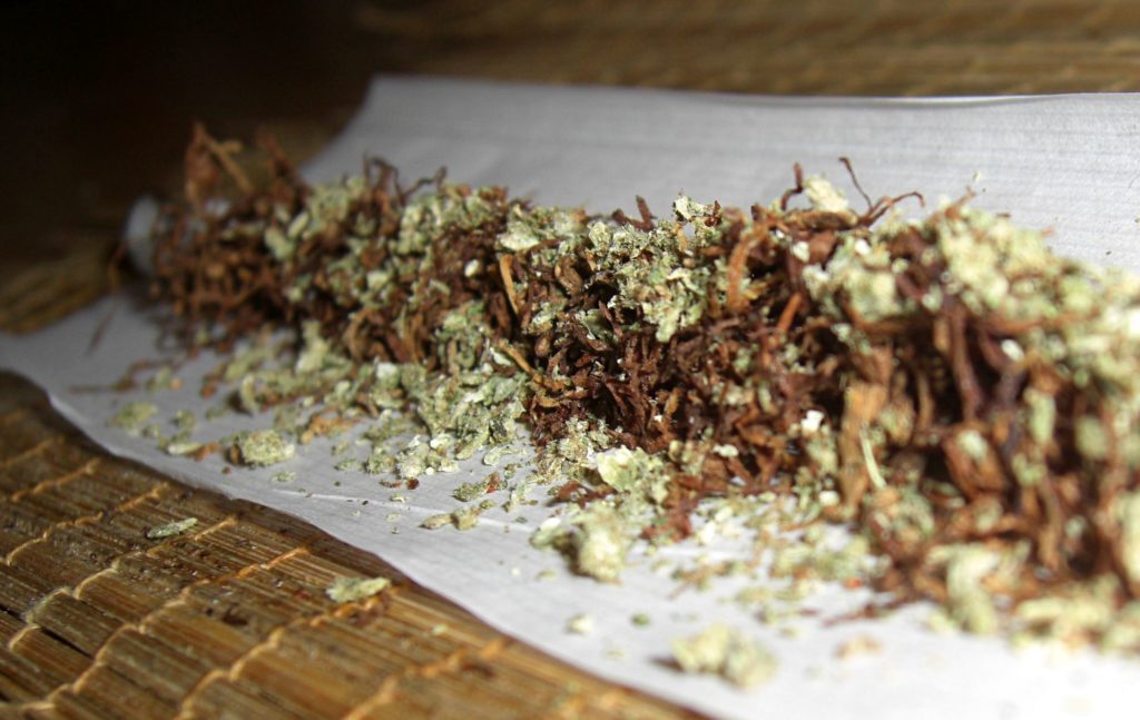 Mix of tobacco and cannabis on a cigarette paper