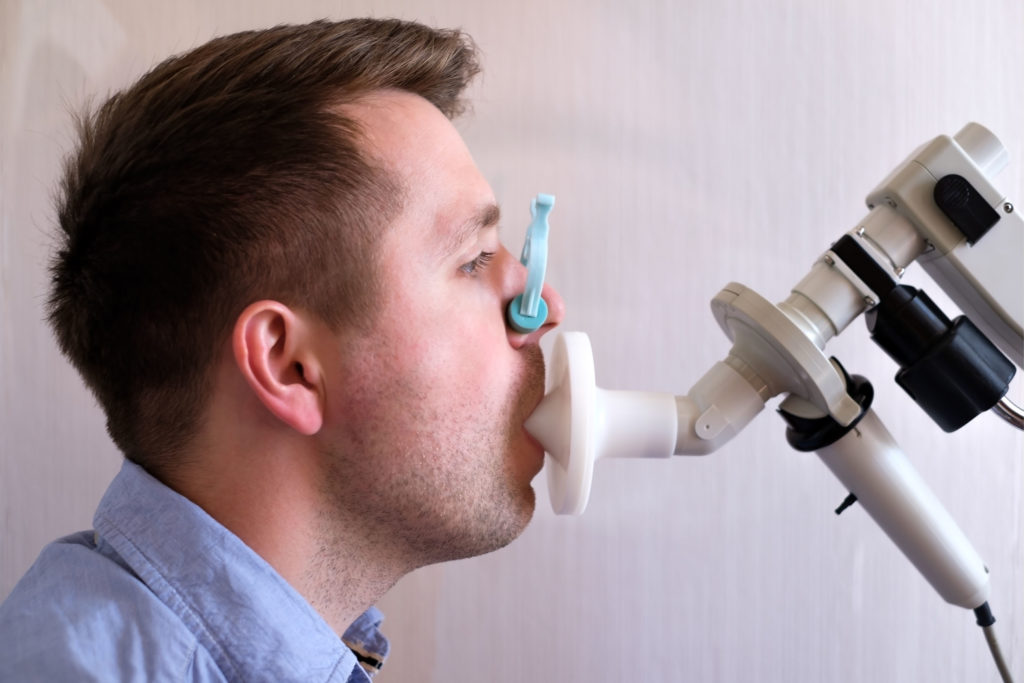 Man performing lung examination