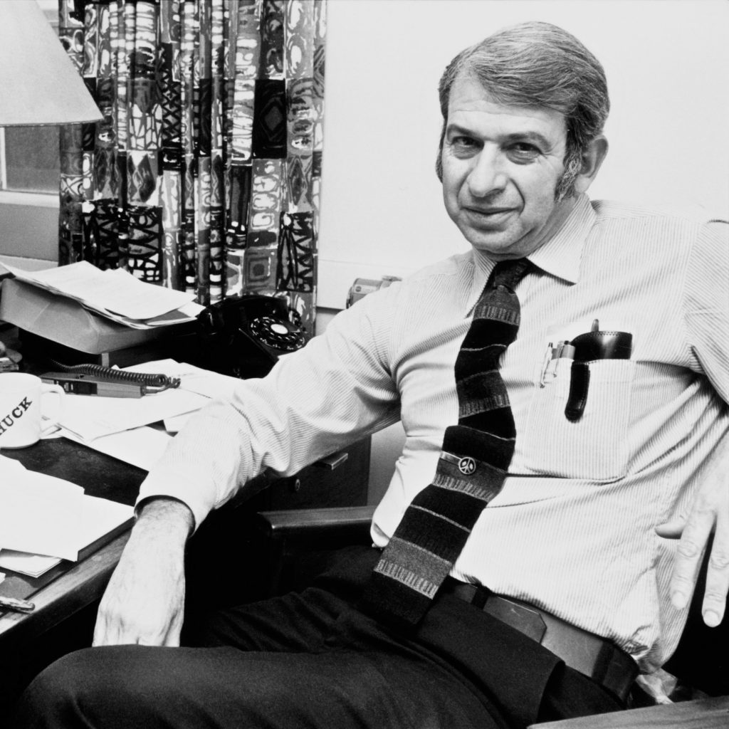 Black and white photo of Dr Lester Grinspoon sitting at the table