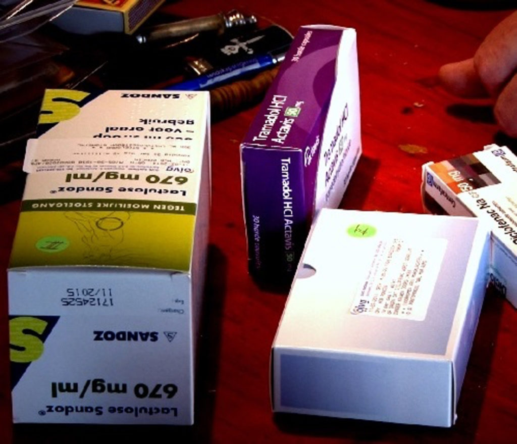 Four packs of medicine on a table