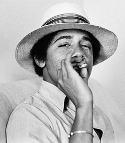 A black and white photograph of a young Barack Obama smoking a joint