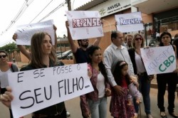 relatives and friends of patients protest for the legalization of cannabidiol outside the Health Surveillance Agency (ANVISA) in Brasilia, Brazil in December 2014. (AP Photo/Eraldo Peres, File. Photo Credit: AP)