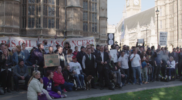 Hundreds of people protesting near the British Parliament for the legalization of cannabis